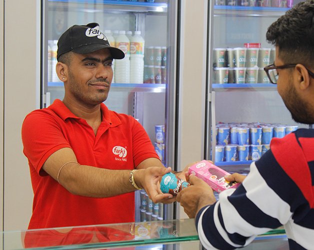 Staff handing over cup